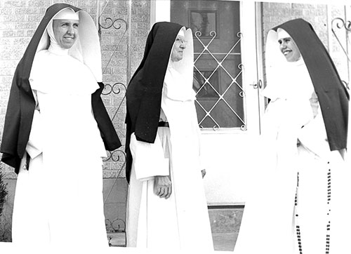 In this photo taken on Oct. 25, 1998, ground is broken for a new church building at St. Jude the Apostle Parish in Spencer. From 1951 to 1998, the parish worshiped in a house that had been converted into a church. Pictured are Father Paul Dede, pastor of the parish at that time, and members of the parish council and building committee. The new church was dedicated on May 14, 2000, and the original church building became the Paul M. Dede Parish Center.