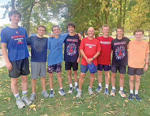 As the boys&rsquo; cross-country coach at Roncalli High School in Indianapolis, Jeff Buckley (fifth from the left) encourages his seniors to take the lead in prayer sessions at the end of practices. Here he poses with this year&rsquo;s seniors, Joey McCoy, left, Trent Lamarca, Cliff Lamarca, Evan Wright, Zeke Littell, Will Lewis and Thomas Mallers. (Photo by John Shaughnessy)
