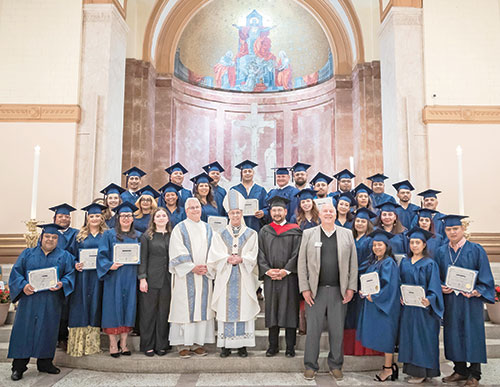 After a Mass at SS. Peter and Paul Cathedral in Indianapolis on May 21, members of the archdiocesan Intercultural Pastoral Institute&rsquo;s (IPI) Class of 2026 pose with the certificates they received for completing the two-year pastoral leadership course. Posing with them are IPI administrator Katherine Guerra, second row, fourth from left, archdiocesan Department of Pastoral Ministries director Deacon Thomas Hosty, Archbishop Charles C. Thompson, archdiocesan Office of Intercultural Ministries director Felix Navarrete and Ken Ogorek, executive director of the archdiocesan Secretariat for Evangelizing Catechesis. (Submitted photo)
