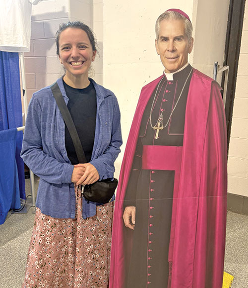 Sara Levy stands with a cutout of Archbishop Fulton J. Sheen before his beatification Mass on Sept. 24 at The Dome at America&rsquo;s Center in St. Louis. (Submitted photo)
