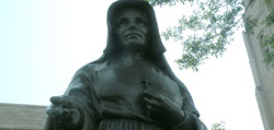 A statue honors St. Theodora Gu&eacute;rin on the Cathedral of the Immaculate Conception grounds at the location of the former academy.