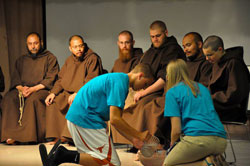During the final day of the retreat, the teens showed their gratitude to the Franciscan Brothers Minor by washing their feet. Travis Rauwerdink, left, and Samantha Baus are shown washing Bother Solanus&rsquo; feet. Brothers in the photo are from left, Father David Engo, superior, Brother Juniper, Bother Felix, Brother Lawrence and Brother Leo Maria.