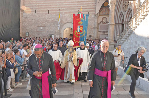 On Oct. 4 in Assisi, Italy, Archbishop Felice Accrocca of the Diocese of Assisi-Nocera Umbra-Gualdo Tadino, carries a relic in a procession outside the Basilica of St. Francis as cardinals, friars and thousands of pilgrims join in the celebration of the 800th anniversary of the death of St. Francis. (OSV News photo/courtesy Sala Stampa Sacro Convento Assisi)